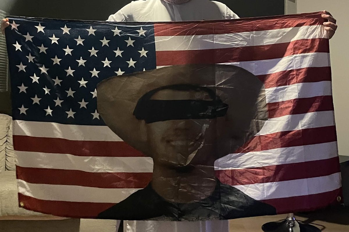 Custom photo flag held up in a living room