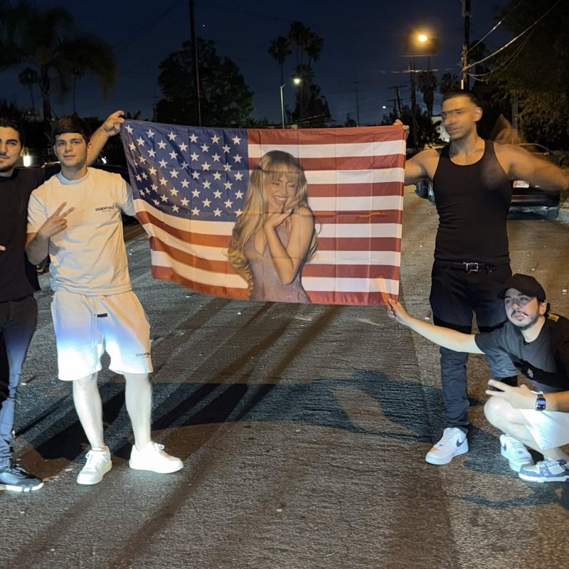 A custom photo flag held up by friends