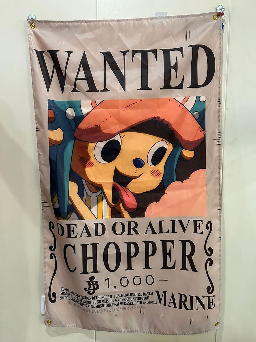 Chopper wanted poster flag hanging on a wall with corner grommets
